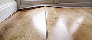 Why Laminate Flooring Is Lifting How, How To Install Laminate Flooring Against Uneven Wall